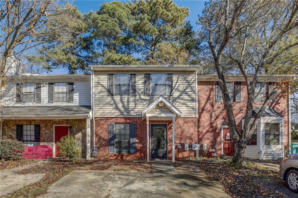 1487 Springleaf Circle Southeast Smyrna, GA 30080 - Photo 1 of 1 front view of a house with a tree