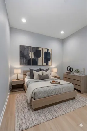 a bedroom with double bed and a large window