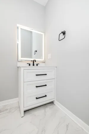 a bathroom with a sink and a mirror