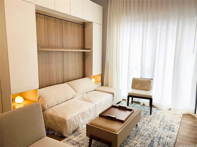 a living room with furniture and a window