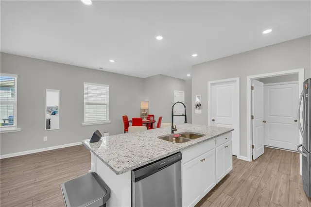 a kitchen with a sink stove and refrigerator