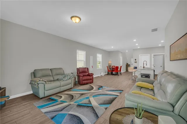 a living room with furniture and a rug