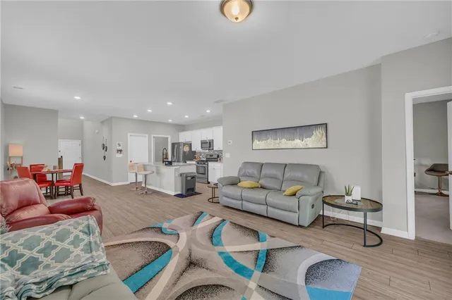 a spacious bedroom with a bed and a cabinets