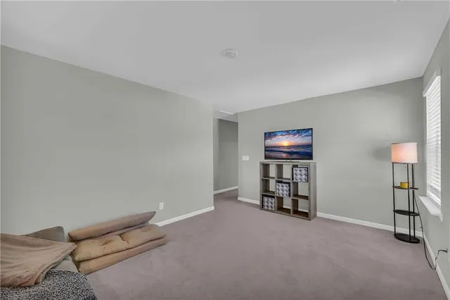 a view of an chairs and table in the back yard