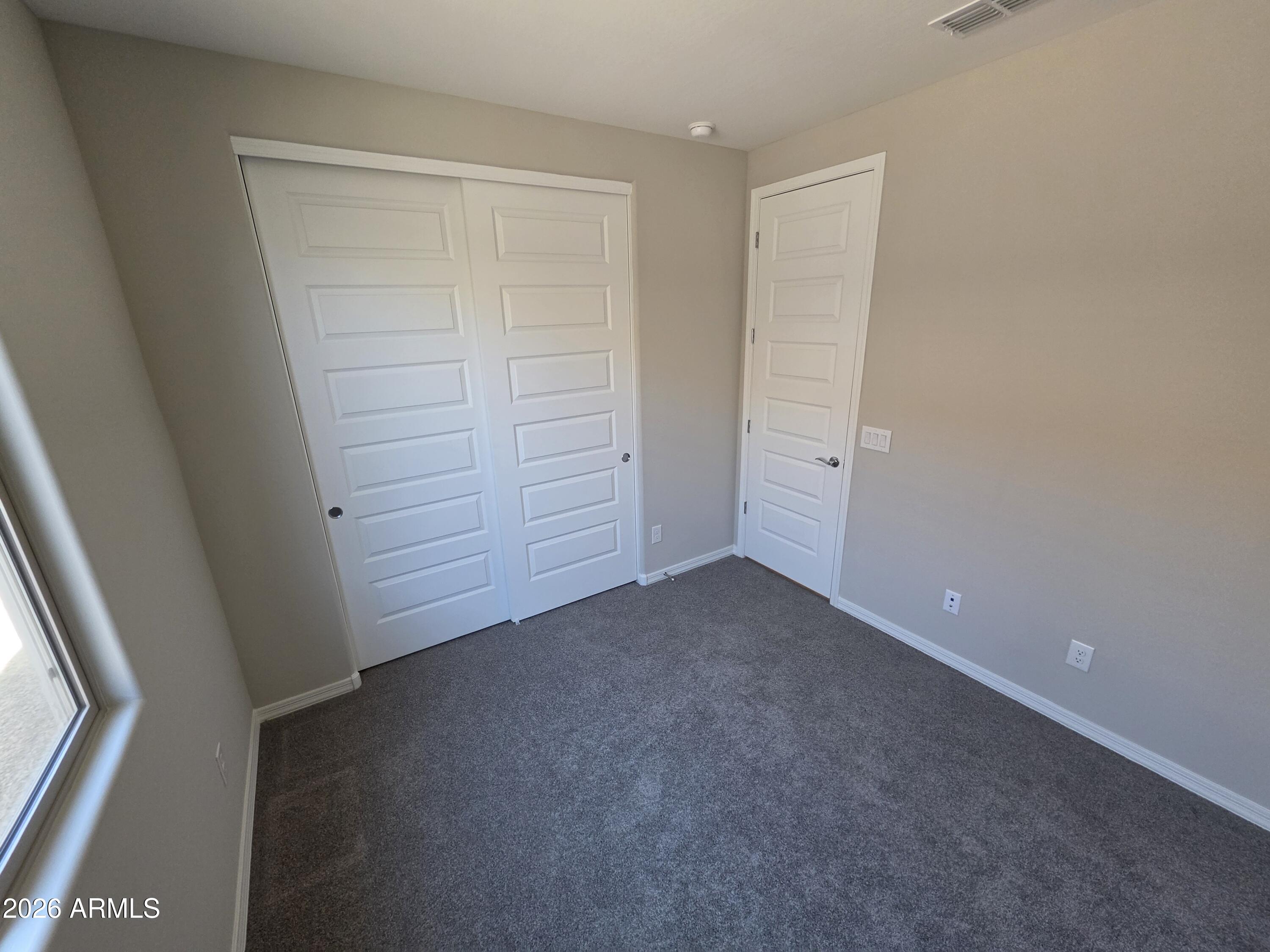 7128 West Coles Road Laveen, AZ 85339 - Photo 29 of 38 an empty room with closet