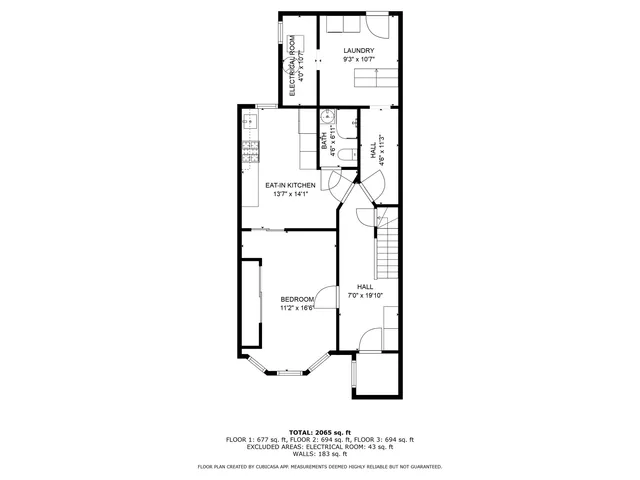 a picture of a bench in front of a wall