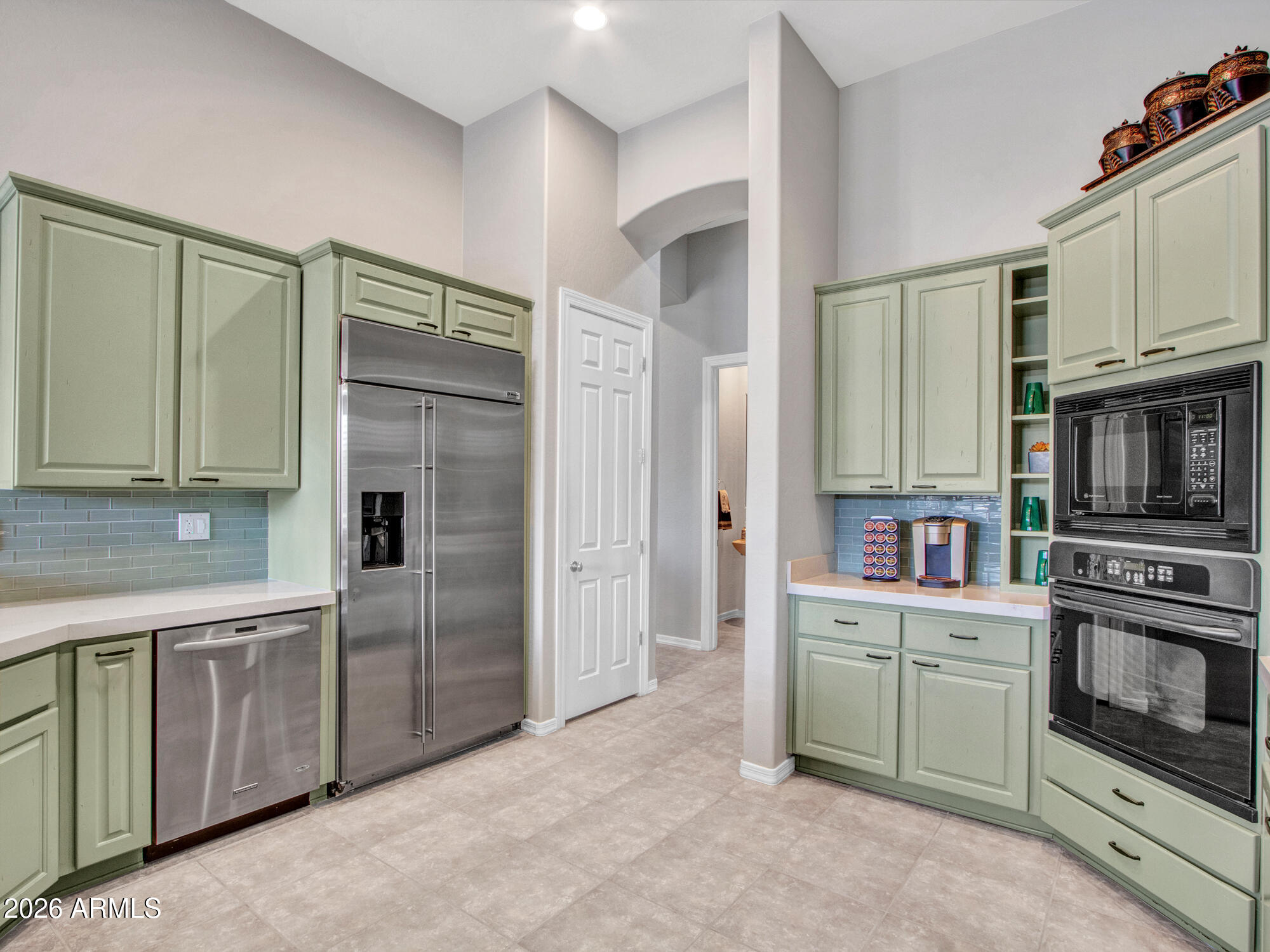 42047 North Moss Springs Road Anthem, AZ 85086 - Photo 23 of 72 a kitchen with stainless steel appliances a refrigerator sink and cabinets