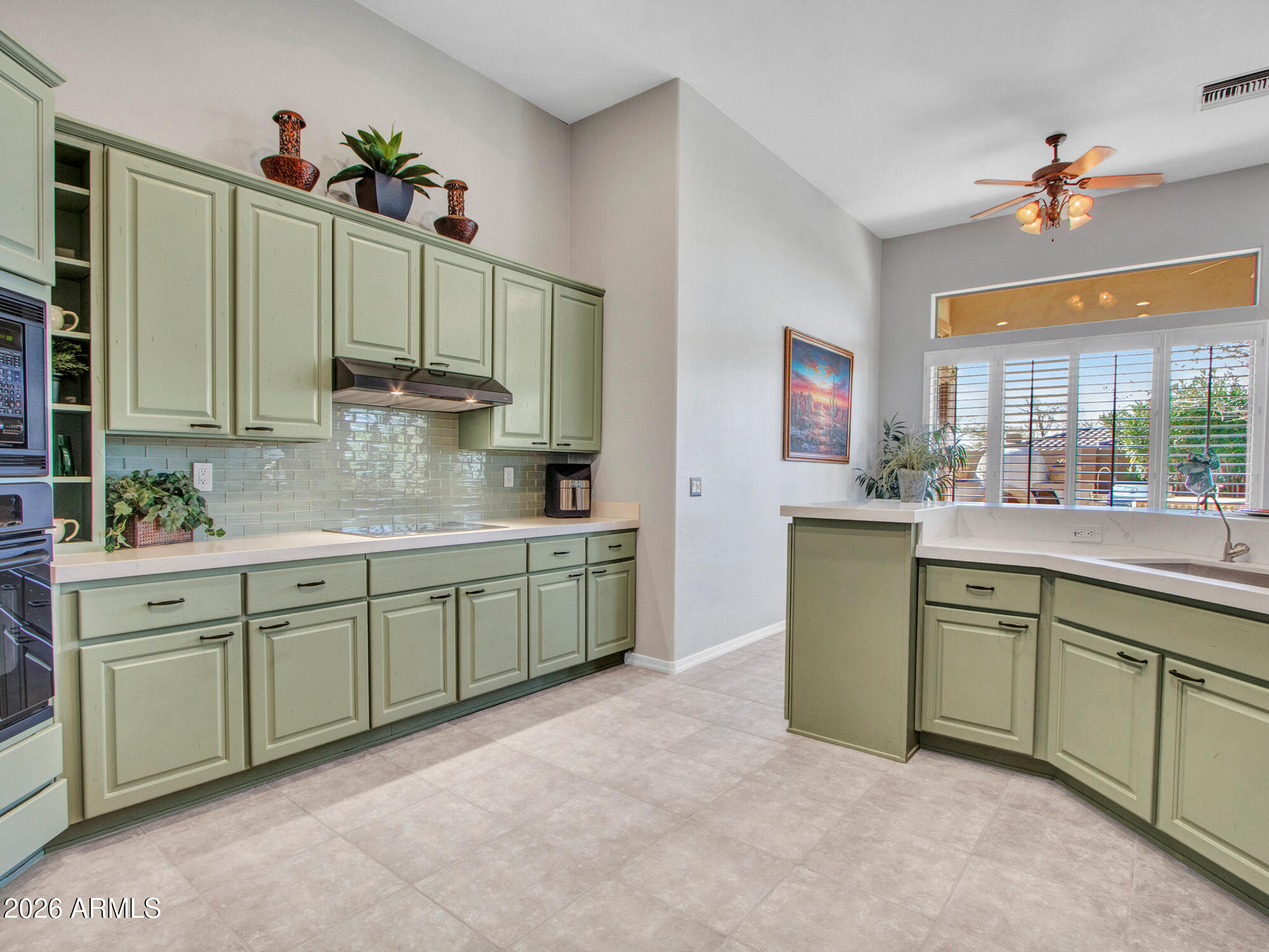 42047 North Moss Springs Road Anthem, AZ 85086 - Photo 24 of 72 a kitchen with cabinets a sink and appliances