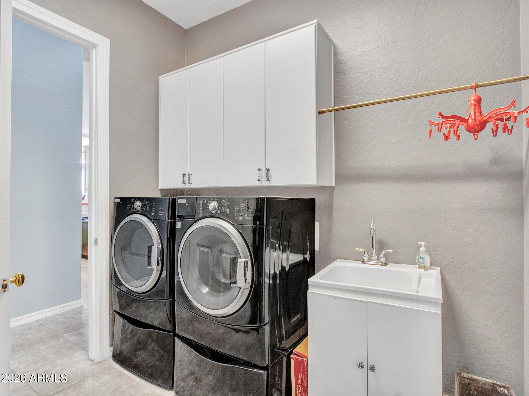 42047 North Moss Springs Road Anthem, AZ 85086 - Photo 28 of 72 a utility room with dryer and washer