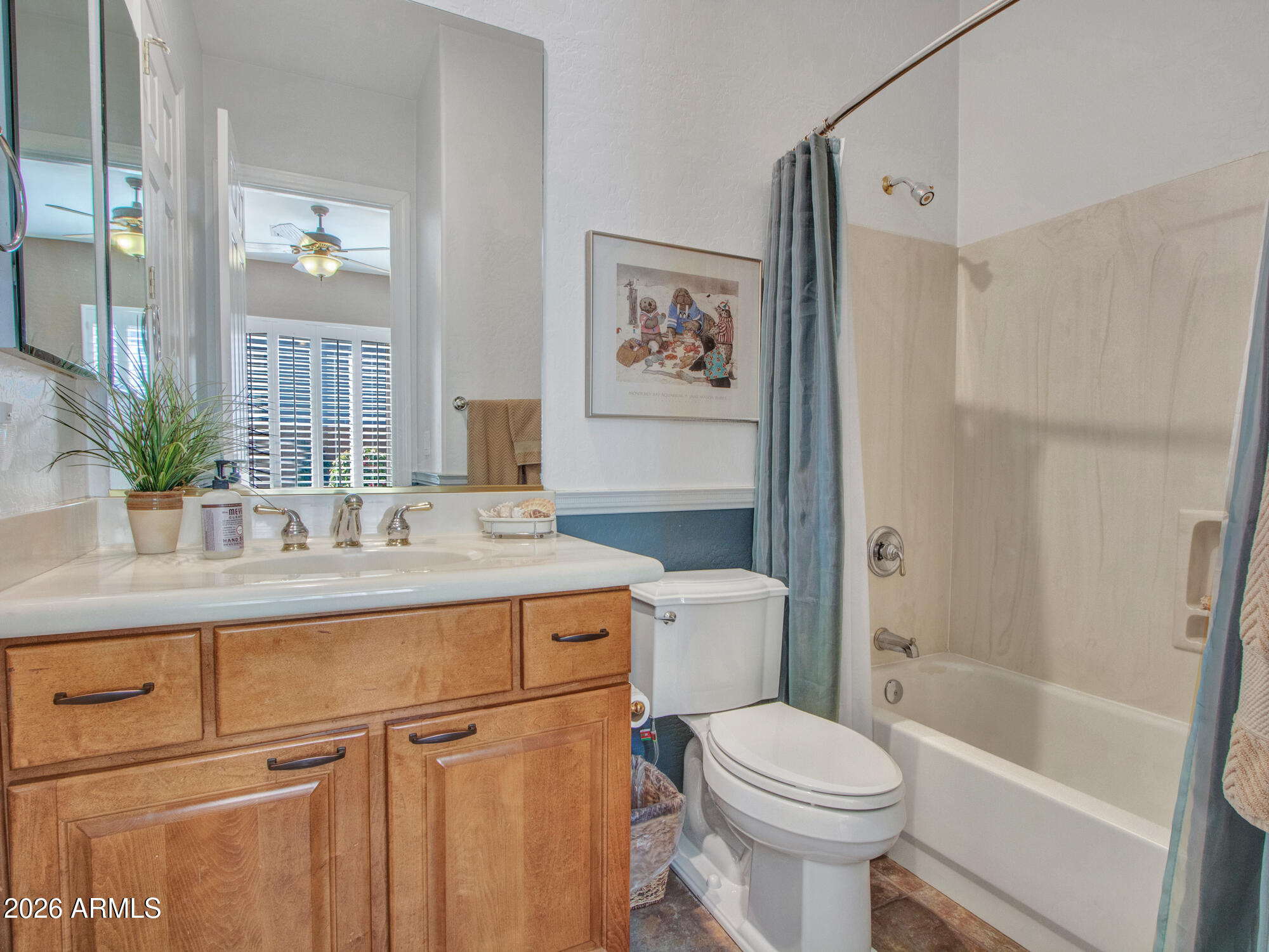 42047 North Moss Springs Road Anthem, AZ 85086 - Photo 31 of 72 a bathroom with a sink a mirror a toilet and a bathtub