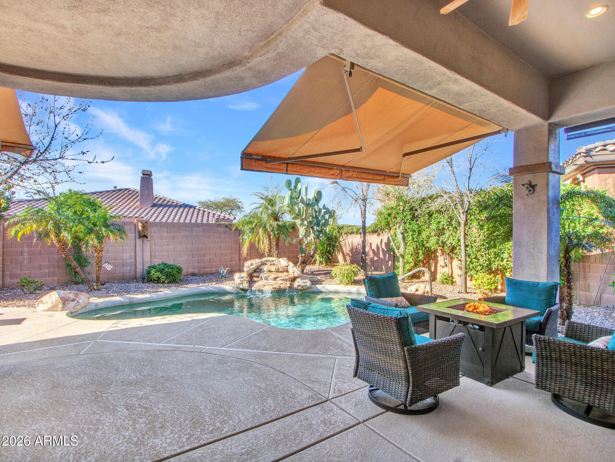 42047 North Moss Springs Road Anthem, AZ 85086 - Photo 40 of 72 a view of a patio with table and chairs potted plants