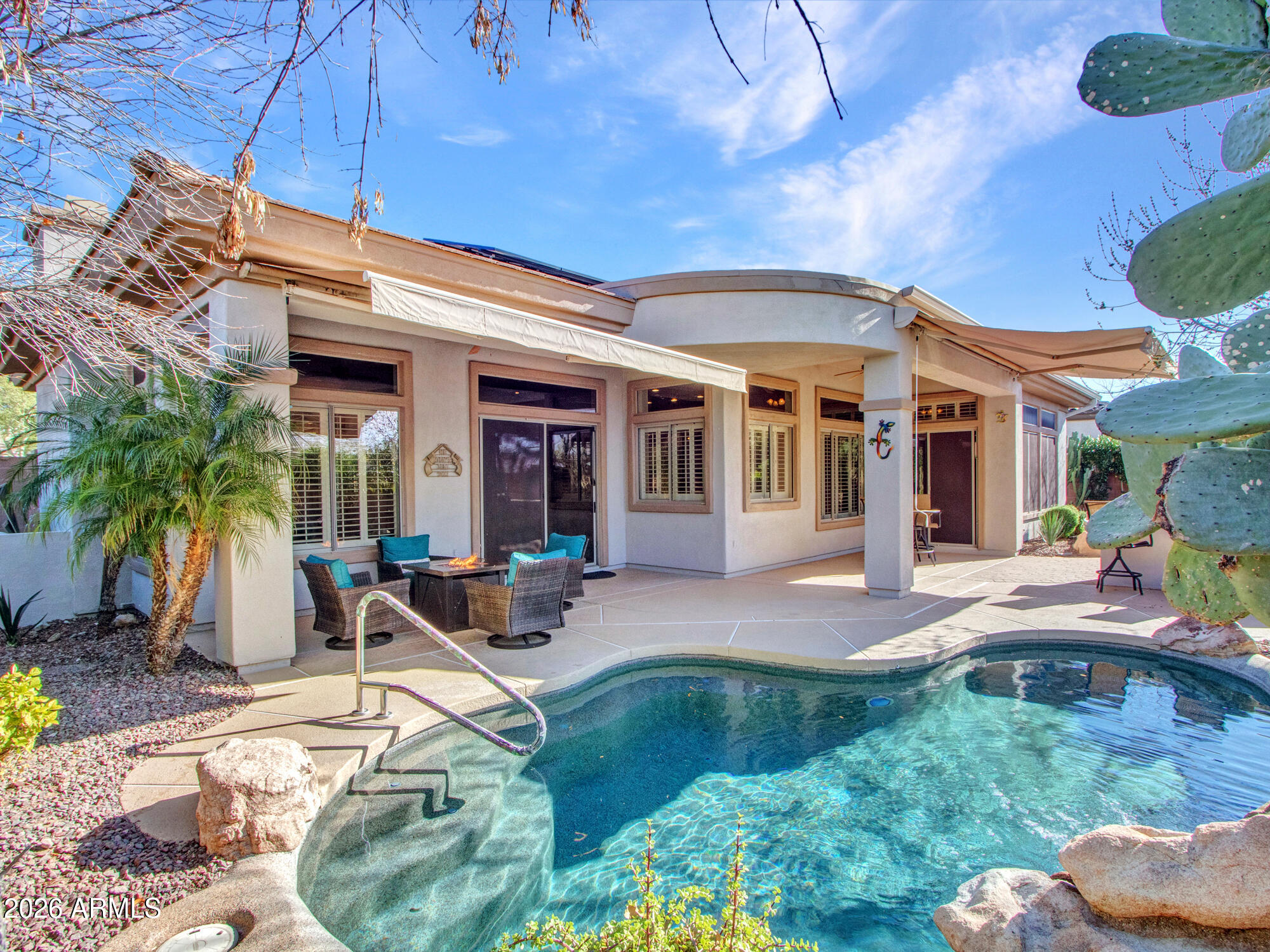 42047 North Moss Springs Road Anthem, AZ 85086 - Photo 42 of 72 a view of a house with swimming pool and sitting area