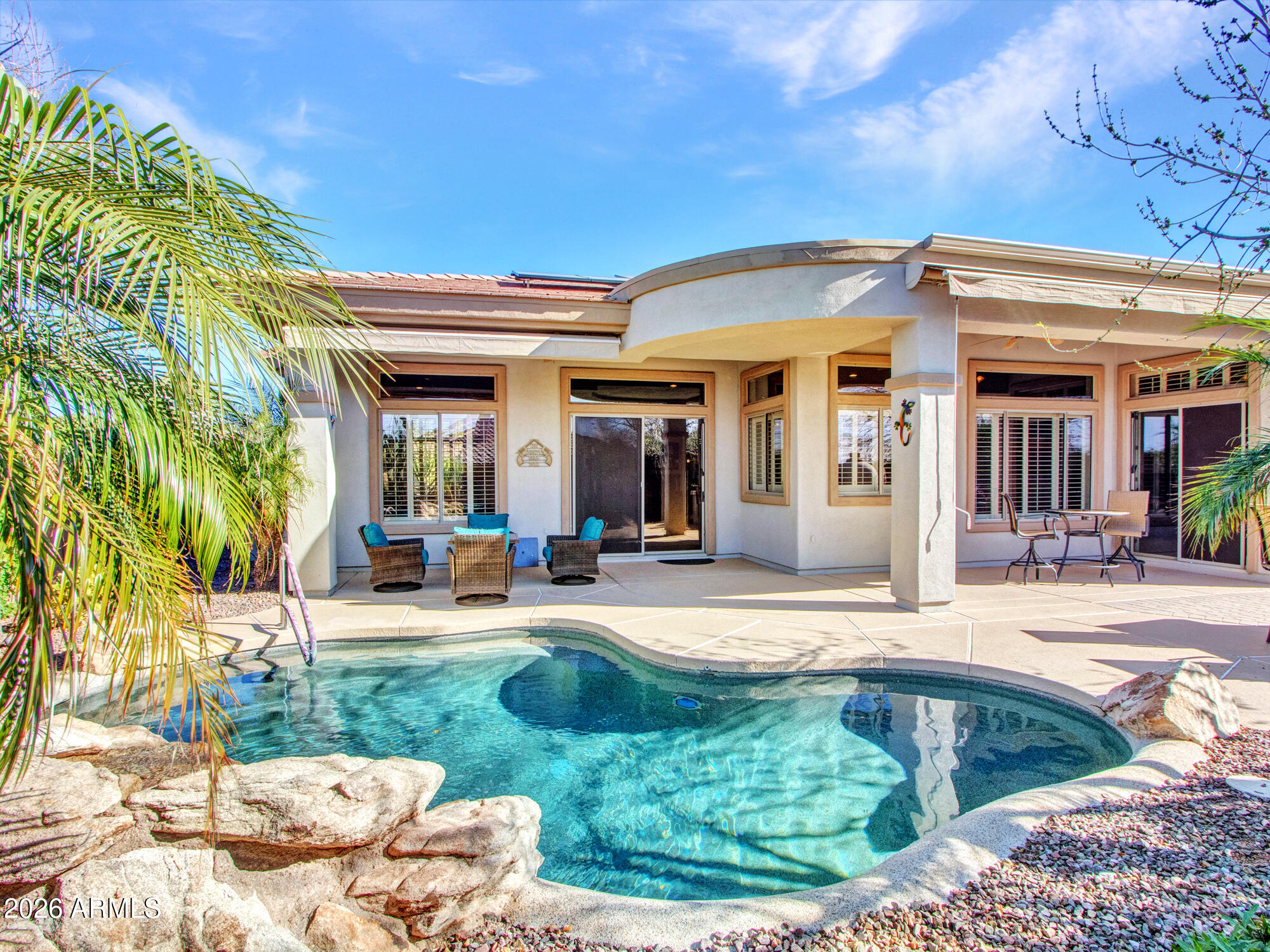 42047 North Moss Springs Road Anthem, AZ 85086 - Photo 52 of 72 a view of a house with entertaining space and swimming pool