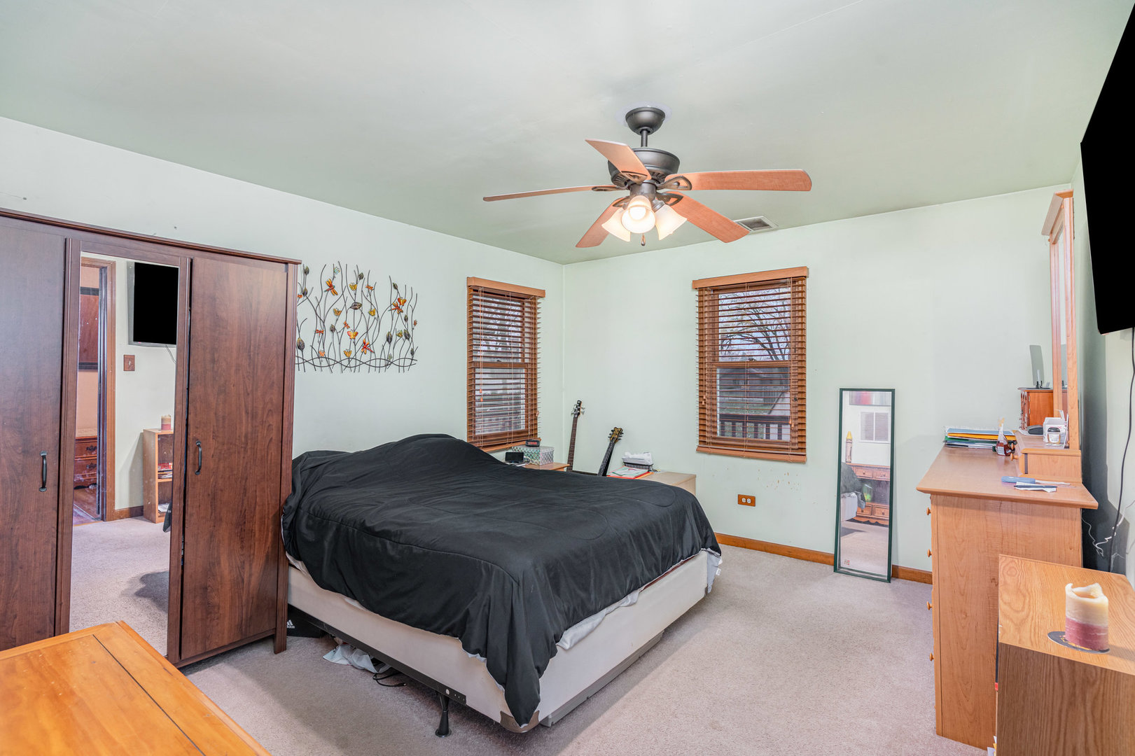 11700 South Springfield Avenue Alsip, IL 60803 - Photo 15 of 21 a bedroom with a bed and a chandelier