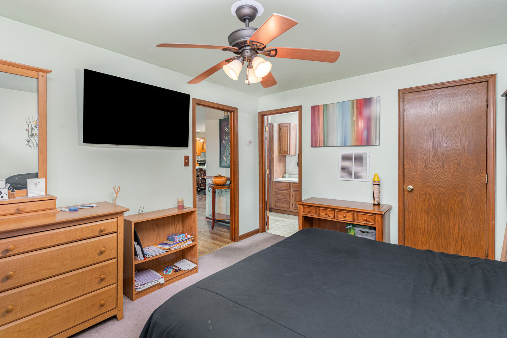 11700 South Springfield Avenue Alsip, IL 60803 - Photo 16 of 21 a bedroom with furniture and a flat screen tv