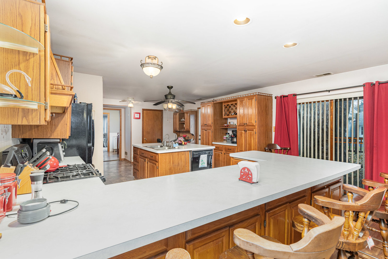 11700 South Springfield Avenue Alsip, IL 60803 - Photo 7 of 21 a living room with kitchen island furniture and a chandelier