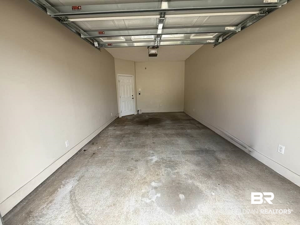 2651 South Juniper Street, Unit 401 Foley, AL 36535 - Photo 3 of 27 Garage with a garage door opener