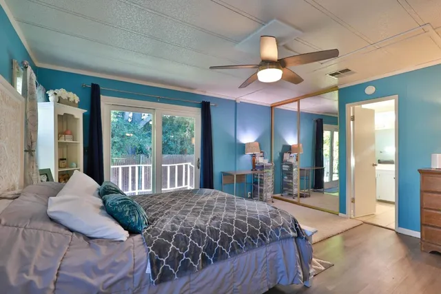 a bedroom with a large bed and a large window