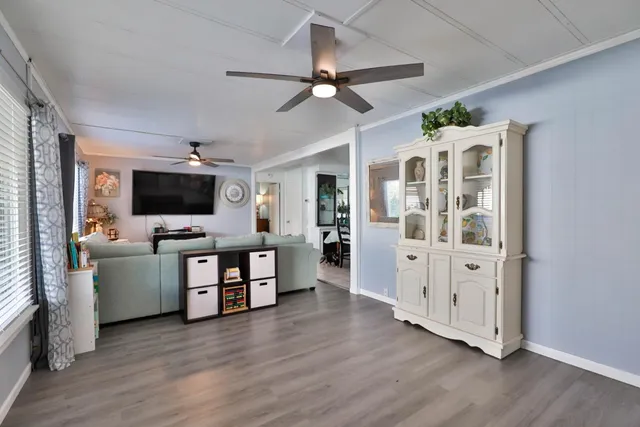 a view of living room with furniture and flat screen tv