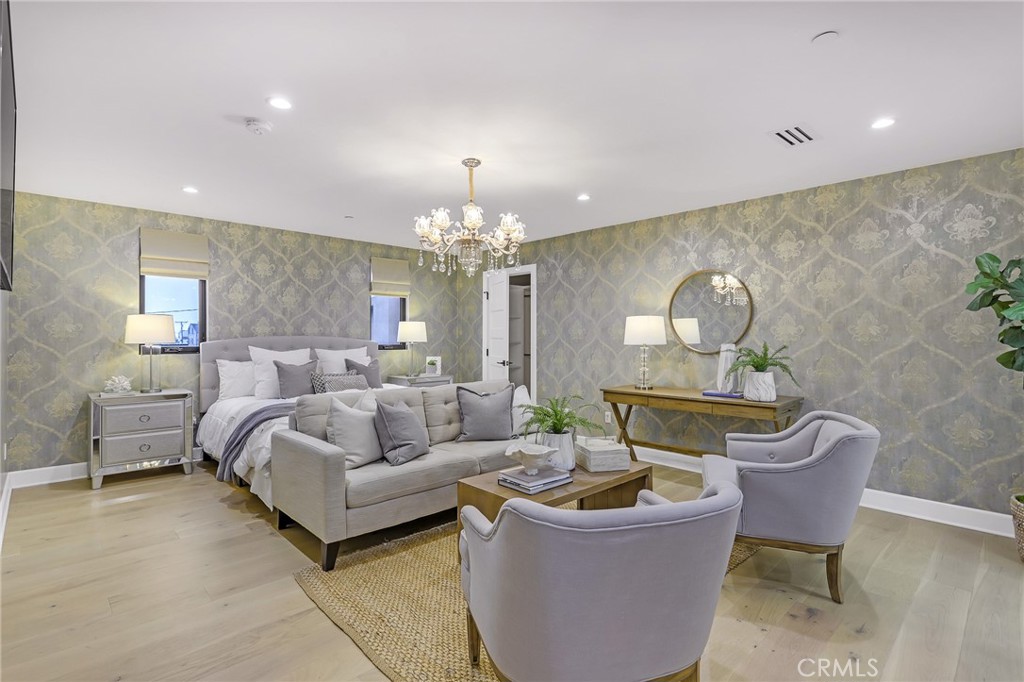 845 4th Street Hermosa Beach, CA 90254 - Photo 14 of 26 a living room with furniture and a chandelier