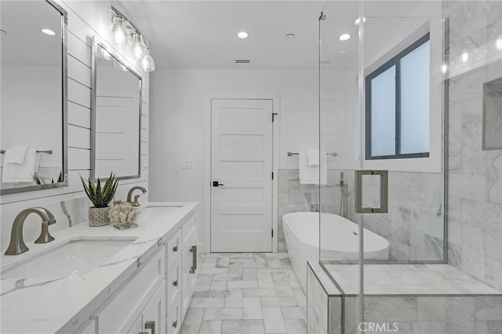 845 4th Street Hermosa Beach, CA 90254 - Photo 15 of 26 a bathroom with a tub sink and mirror