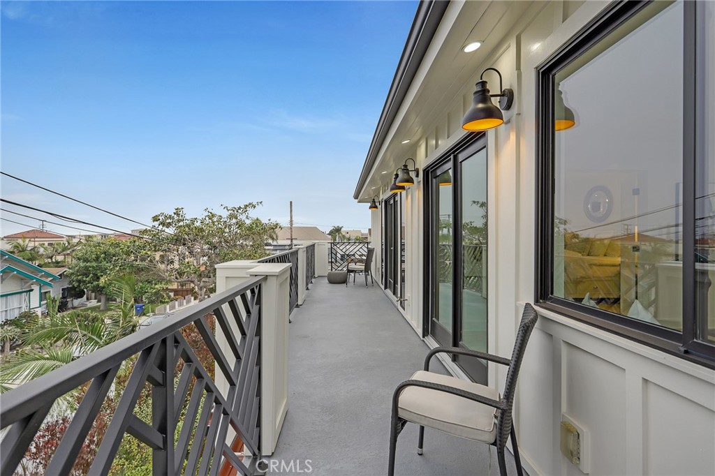845 4th Street Hermosa Beach, CA 90254 - Photo 19 of 26 a balcony view with a large window and furniture