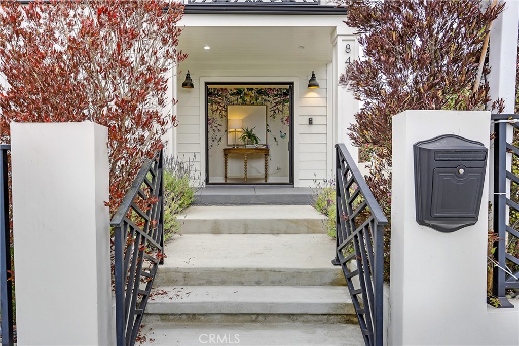 845 4th Street Hermosa Beach, CA 90254 - Photo 2 of 26 a front view of a house with a garden