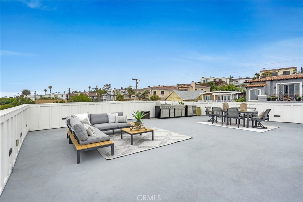 845 4th Street Hermosa Beach, CA 90254 - Photo 21 of 26 a terrace view with outdoor seating and city view