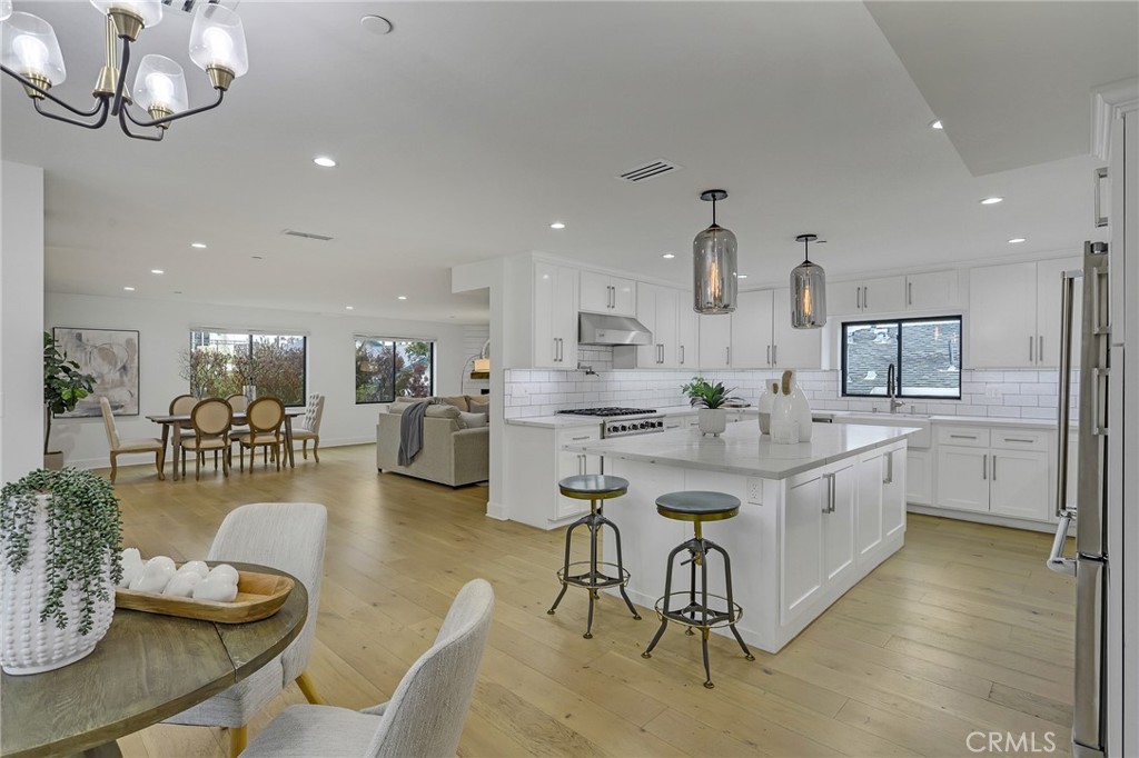 845 4th Street Hermosa Beach, CA 90254 - Photo 8 of 26 a large kitchen with a table and chairs