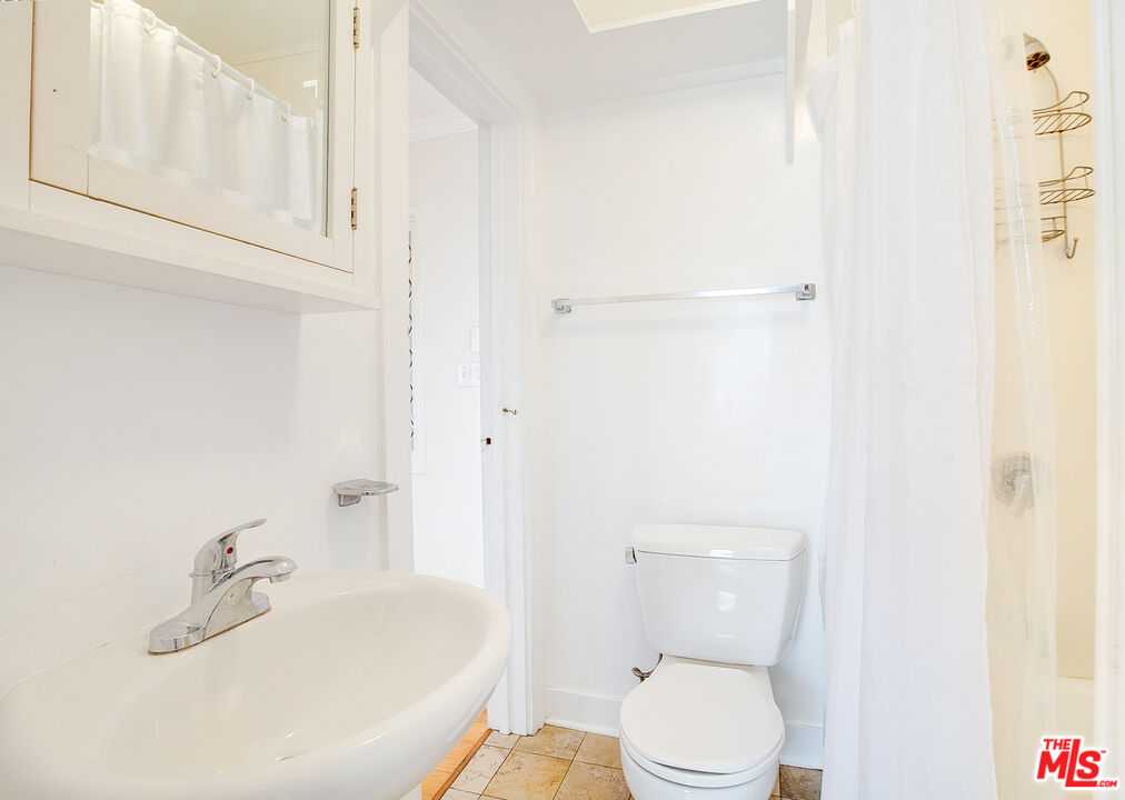 426 Rialto Avenue, Unit B Venice, CA 90291 - Photo 17 of 17 a white toilet sitting next to a bathroom sink