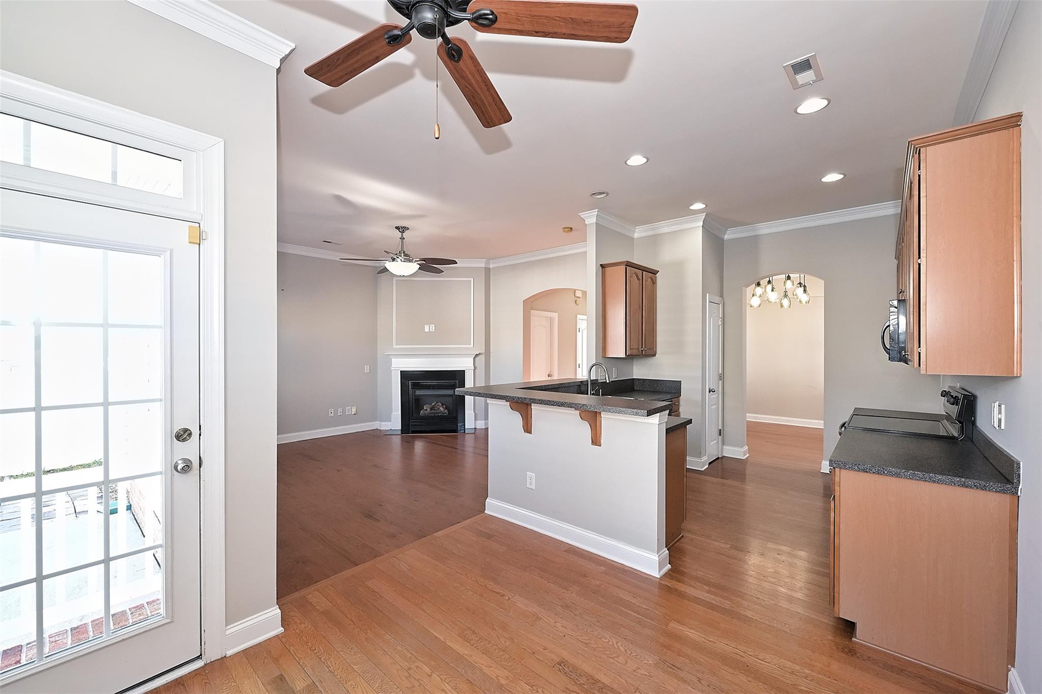 10725 Serape Road Charlotte, NC 28277 - Photo 13 of 30 a view of a living room and kitchen with wooden floor