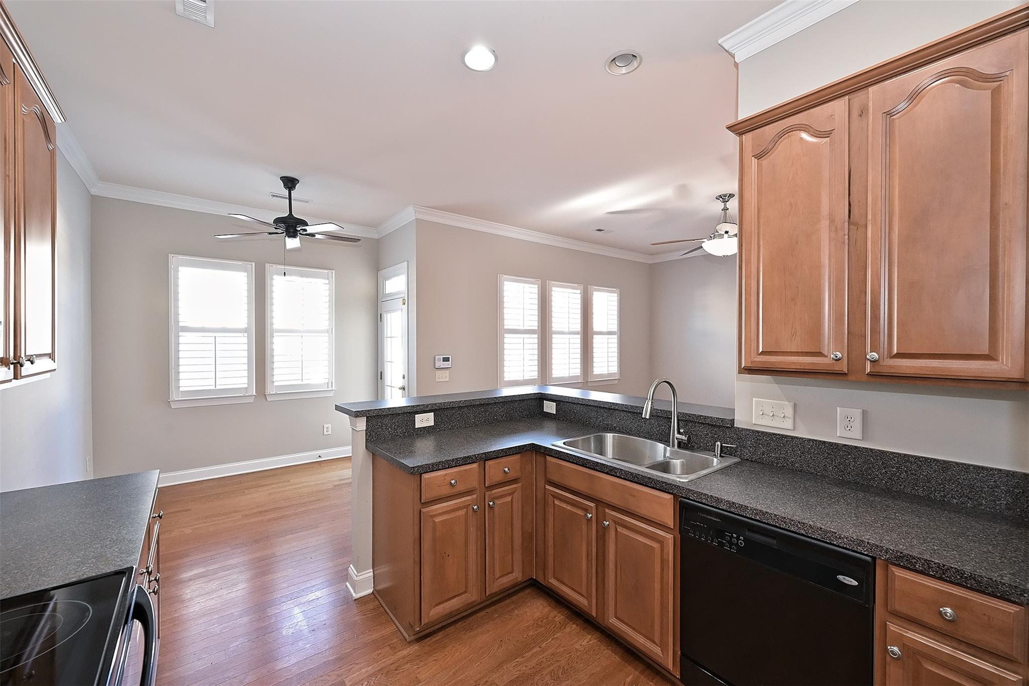 10725 Serape Road Charlotte, NC 28277 - Photo 15 of 30 a kitchen with granite countertop a sink stove and cabinets