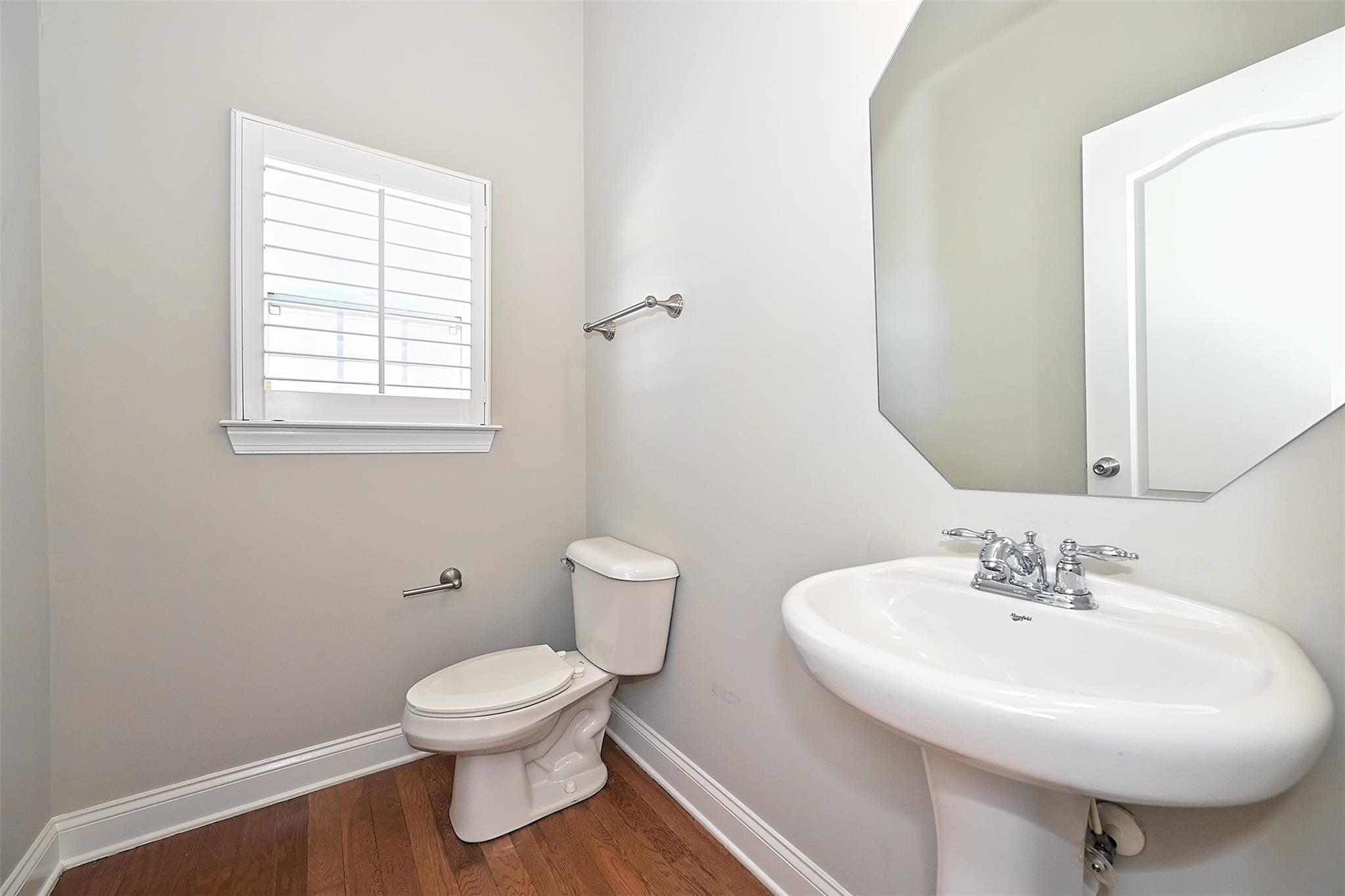 10725 Serape Road Charlotte, NC 28277 - Photo 16 of 30 a bathroom with a toilet sink and mirror