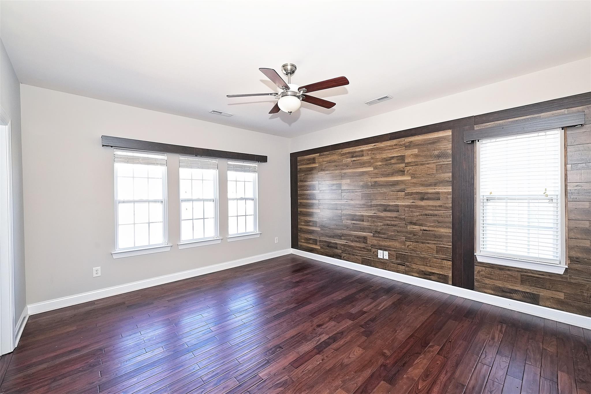 10725 Serape Road Charlotte, NC 28277 - Photo 18 of 30 a view of an empty room with wooden floor and a window