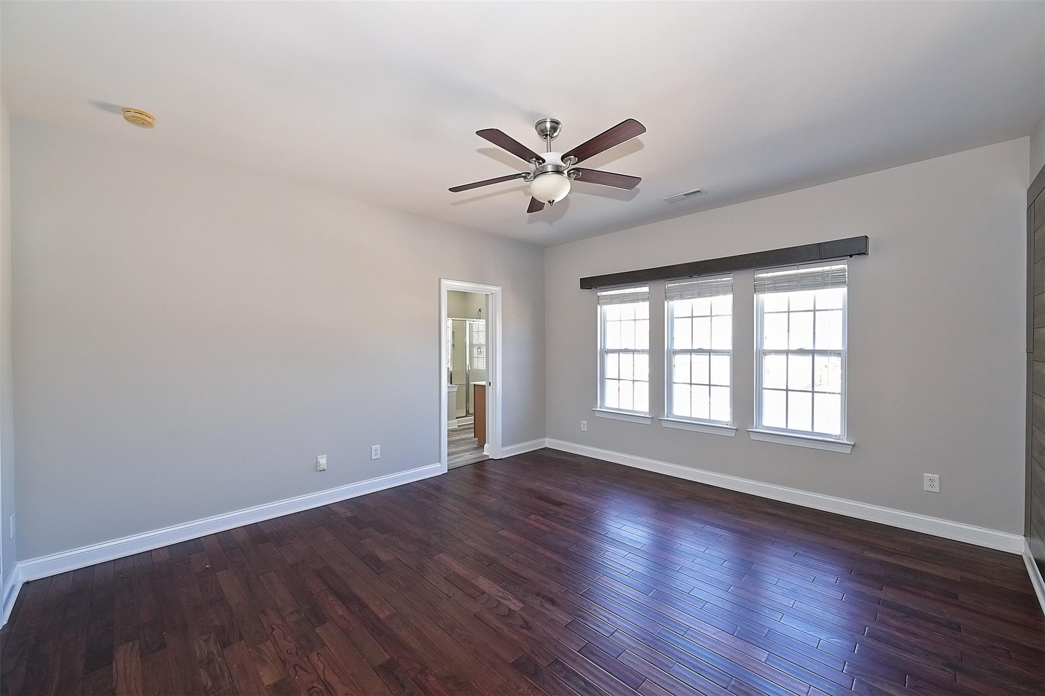 10725 Serape Road Charlotte, NC 28277 - Photo 19 of 30 a view of wooden floor and windows in a room