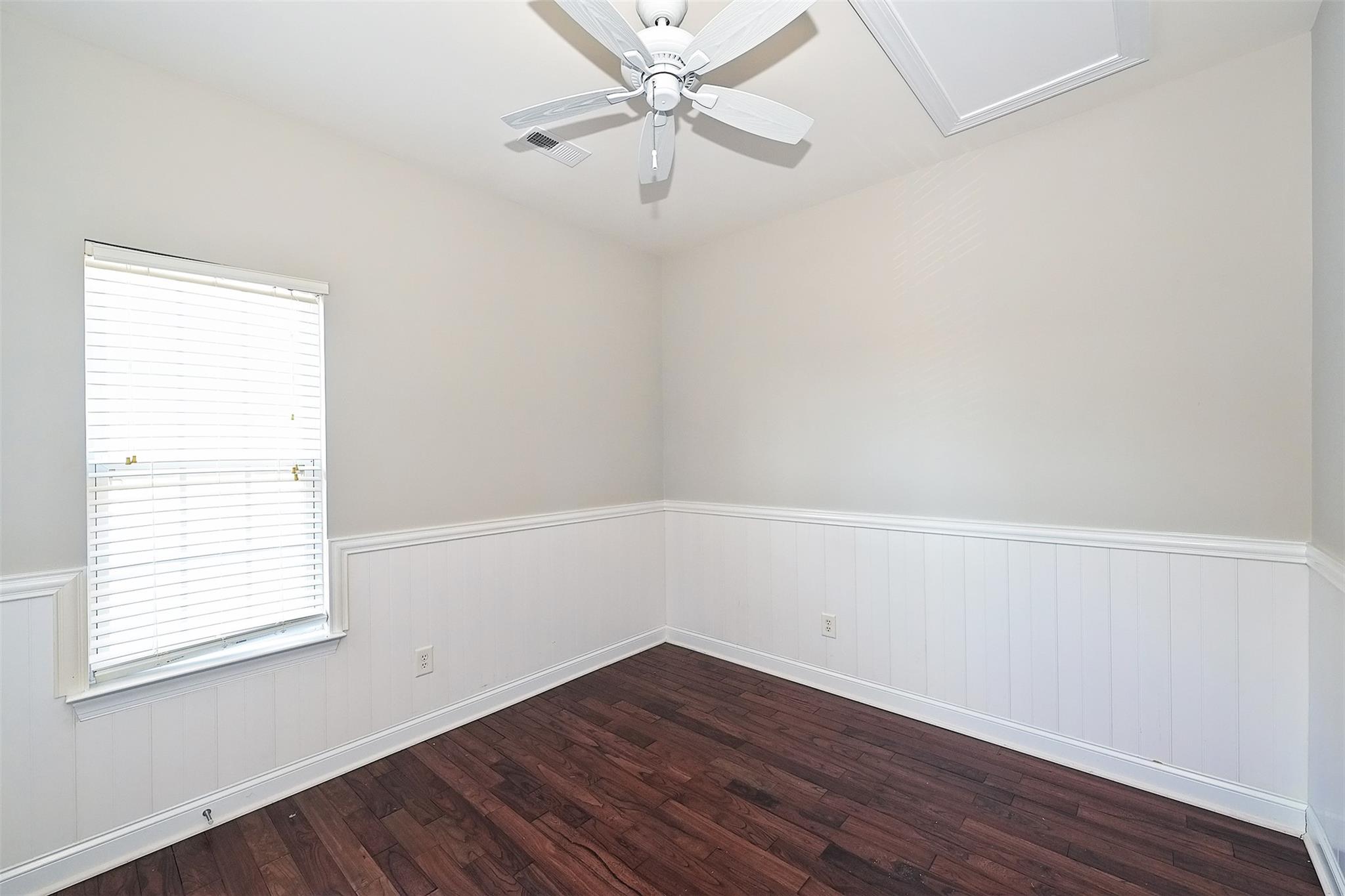 10725 Serape Road Charlotte, NC 28277 - Photo 20 of 30 an empty room with a window and wooden floor