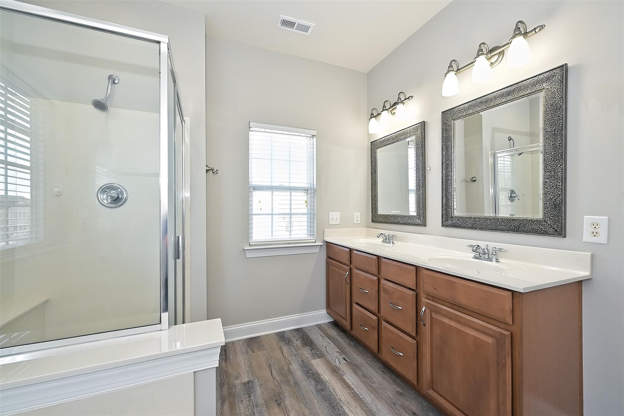 10725 Serape Road Charlotte, NC 28277 - Photo 22 of 30 a bathroom with a sink and a mirror
