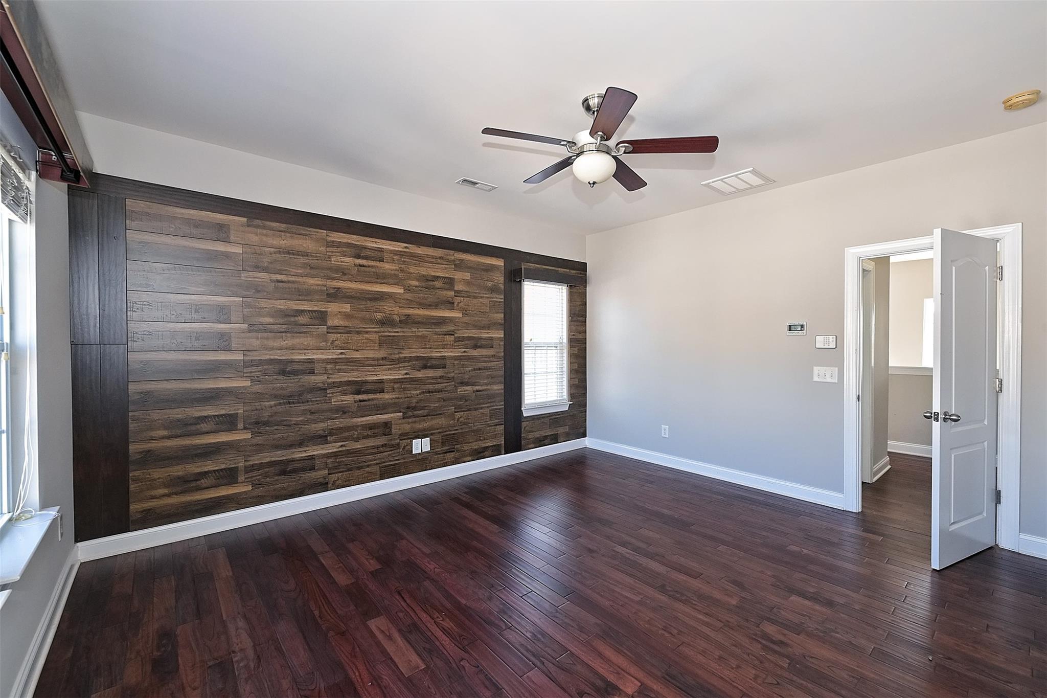 10725 Serape Road Charlotte, NC 28277 - Photo 23 of 30 a view of an empty room with wooden floor and a window