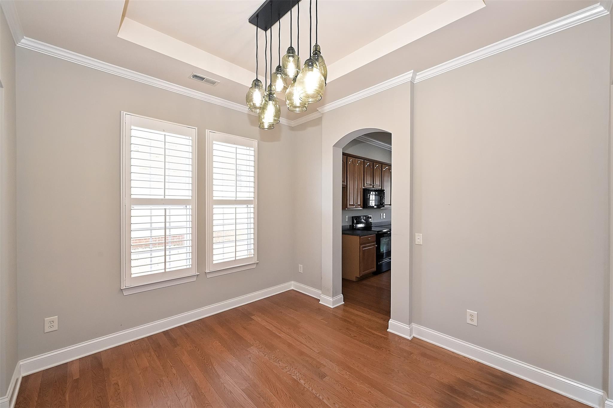10725 Serape Road Charlotte, NC 28277 - Photo 6 of 30 wooden floor in an empty room with a window