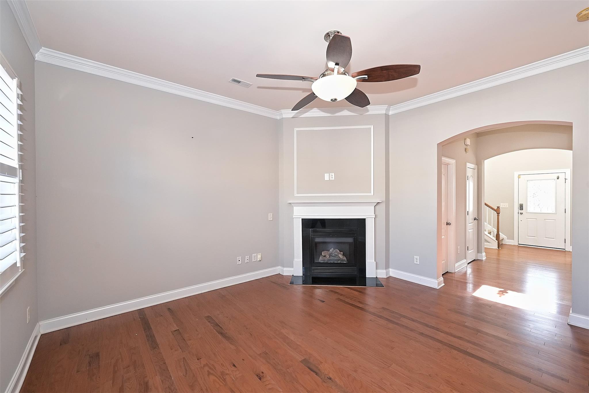 10725 Serape Road Charlotte, NC 28277 - Photo 8 of 30 a view of empty room with wooden floor and fireplace