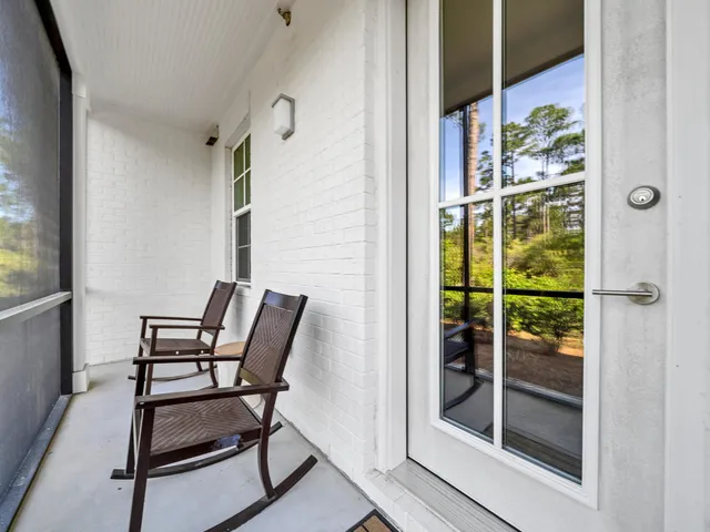 a view of a chairs and table in a room