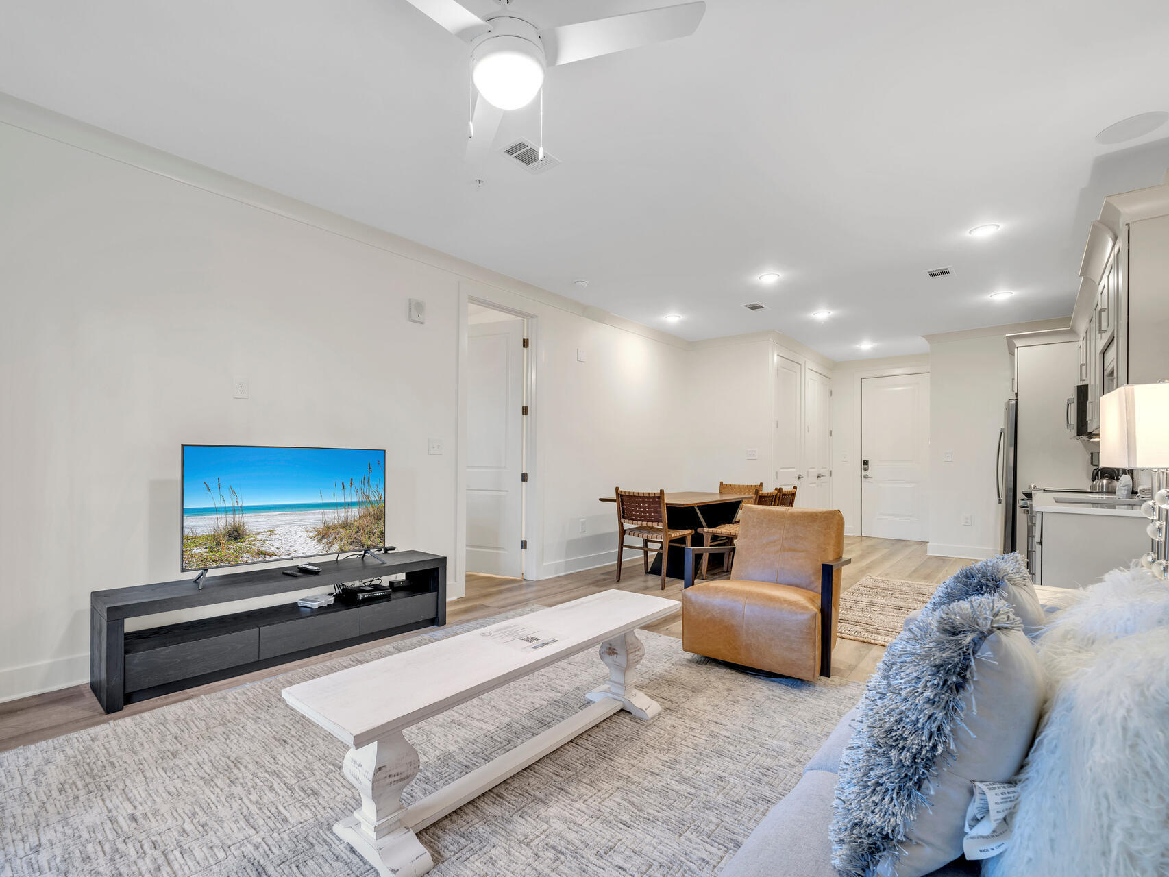 179 South County Highway 393, Unit 415 Santa Rosa Beach, FL 32459 - Photo 6 of 26 a living room with furniture and a flat screen tv