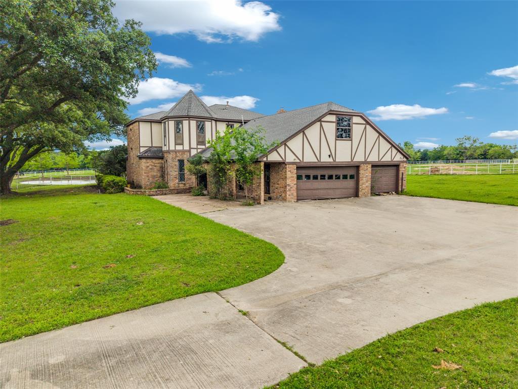 342 East Tripp Road Sunnyvale, TX 75182 - Photo 1 of 5 a front view of a house with garden