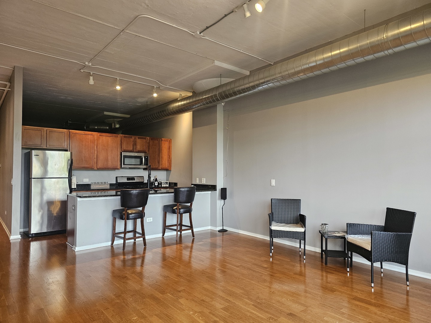 2323 West Pershing Road, Unit 230 Chicago, IL 60609 - Photo 11 of 30 a kitchen with a table chairs and a kitchen view