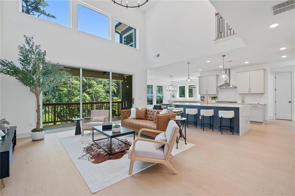 461 Maypop Lane Woodstock, GA 30188 - Photo 11 of 18 a living room with furniture and a large window