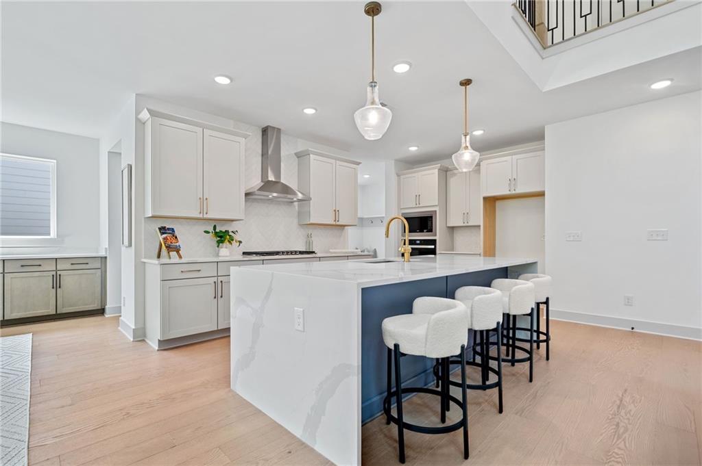461 Maypop Lane Woodstock, GA 30188 - Photo 7 of 18 a kitchen with a sink cabinets and window