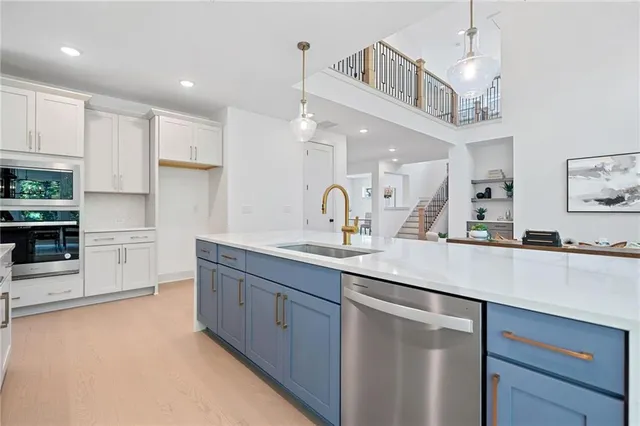 a kitchen with a sink cabinets and window
