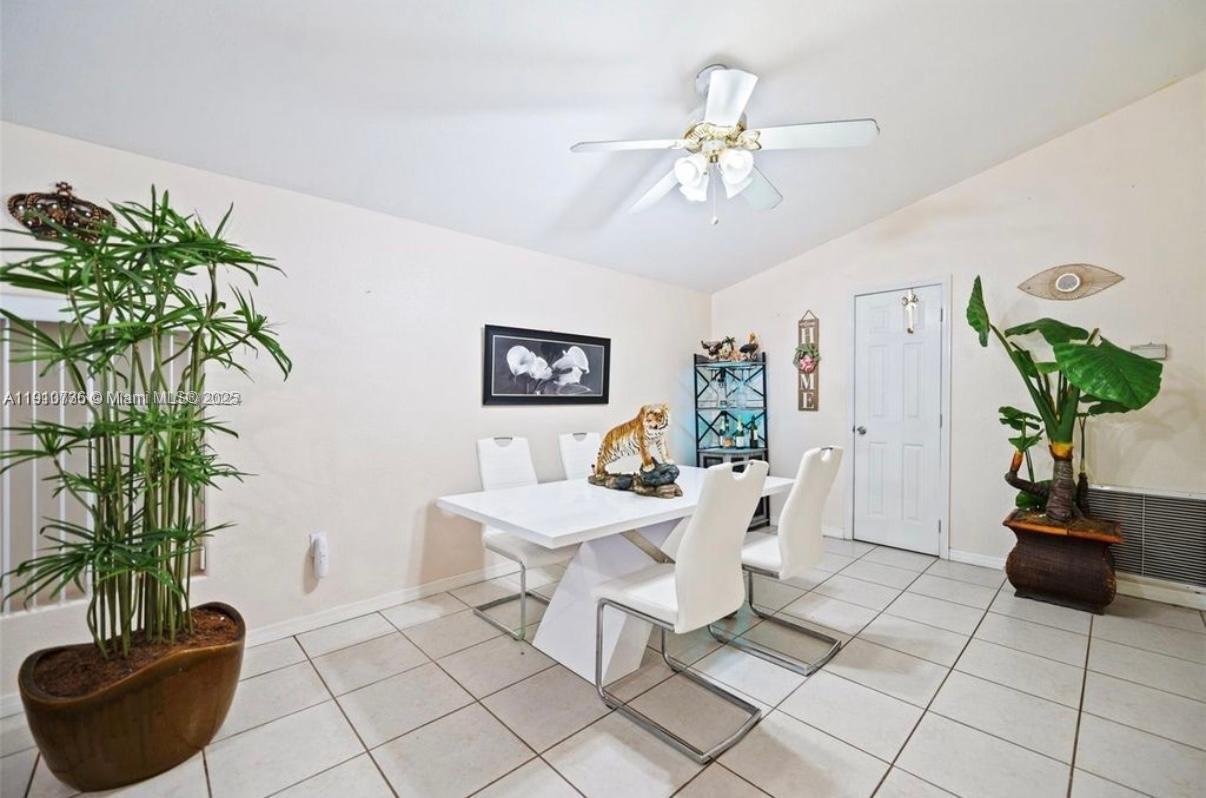 20235 Southwest 172nd Avenue Miami, FL 33187 - Photo 19 of 30 a living room with furniture and a potted plant
