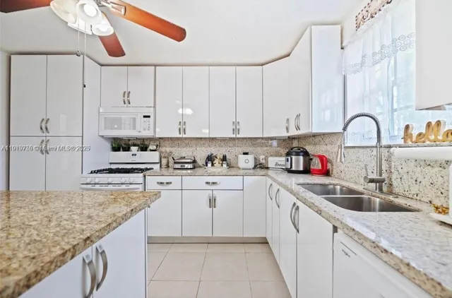 a dining room with furniture and a wooden floor