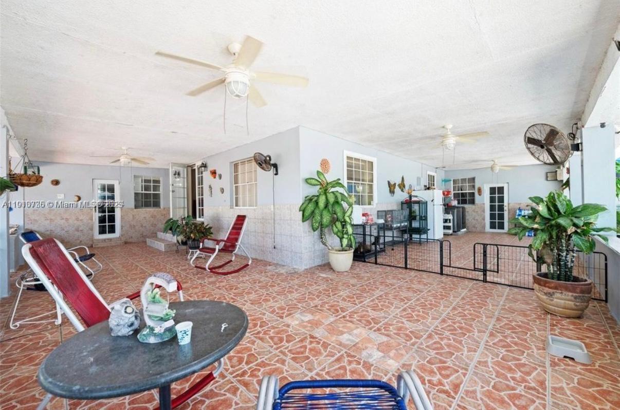 20235 Southwest 172nd Avenue Miami, FL 33187 - Photo 21 of 30 a dining room with furniture and a wooden floor